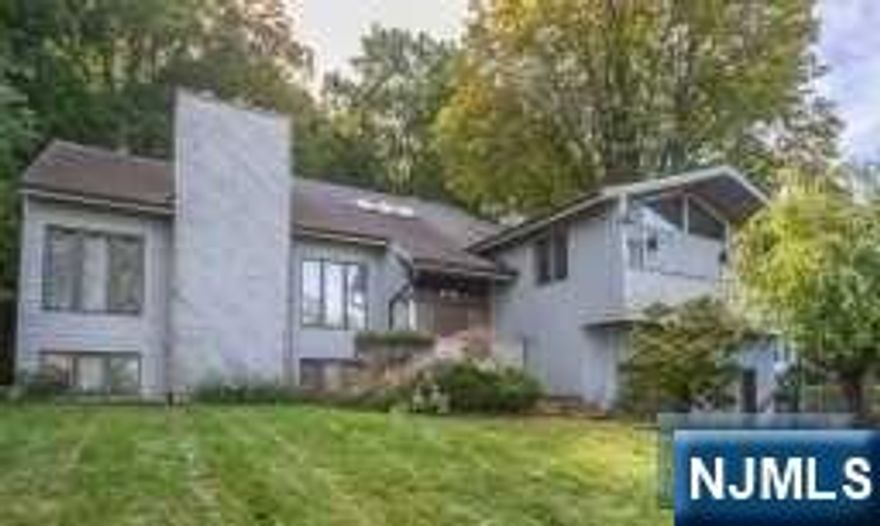 Bring your vision to this HUGE home with gorgeous LAKE VIEWS! Nearly 4400 square feet PLUS a finished walk out basement that could possibly be converted into an inlaw suite. This home needs TLC, but has enormous potential! Private backyard! Soaring ceilings, large room sizes, flexible floorplan! Master bedroom has a deck overlooking the lake. Cul de sac location! Amazing Pompton Lakes!! NON FLOOD! Property is being sold strictly AS IS. Cash or renovation loan only.