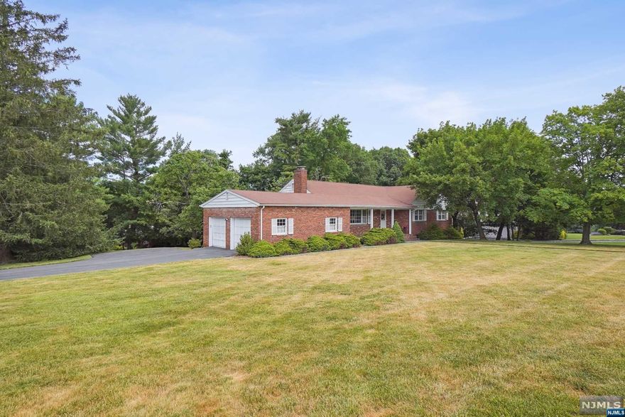 Your dream of home ownership in tranquil and desirable North Caldwell can come true in this mid century brick ranch on a beautiful cul-de-sac, at the highest point in town.Located in a very beautiful and well maintained neighborhood, this ranch offers a comfortable and convenient lifestyle. Earlier homeowners enjoyed this residence for many years and are passing it on for you to continue the tradition and make it your own! The single story living and open layout boasts a large living room with wood burning fireplace, dining room with french doors leading to a step down sunroom to enjoy your morning coffee and an Eat-in kitchen. Laundry area on 1st. floor too! Large Primary bedroom with ample closet space offers a stall shower and vanity. Hardwood floors through most of home. Property is perfect for outdoor activity, relaxation and entertaining. Enjoy quaint porch in front and wood deck off sunroom and kitchen, overlooking large backyard. Huge unfinished walk out basement.