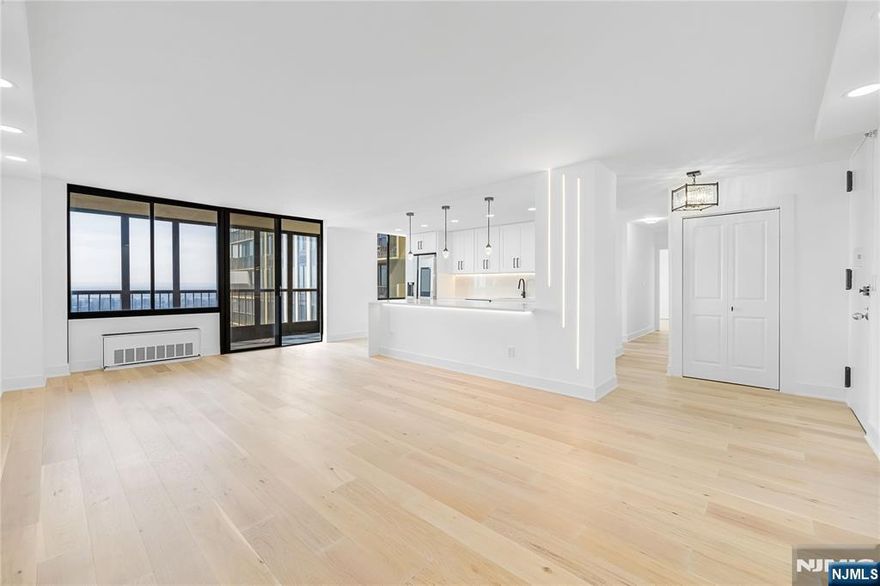 Experience modern waterfront living at 200 Winston Drive, Residence 2417, a fully renovated 2-bedroom, 2-bath home in the sought-after Winston Towers complex in Cliffside Park. This high-floor corner unit features an open-concept layout with hardwood floors throughout and expansive windows that flood the space with natural light. The south/west exposure showcases sweeping views of the Hudson River and the dramatic New York City skyline, creating a striking backdrop for everyday living and entertaining. The gourmet kitchen is appointed with quartz countertops, sleek cabinetry, and premium finishes, complemented by LED lighting that continues through the kitchens and bathrooms for a clean, contemporary look. Both bathrooms are updated with modern fixtures and materials, enhancing the home's polished, chic aesthetic. Located along the Hudson River waterfront, 200 Winston Drive offers convenient access to Manhattan via nearby bus and ferry options, as well as close proximity to local shopping, dining, and major highways. This residence combines style, comfort, and an exceptional NYC view in one of Cliffside Park's most established full-service communities.