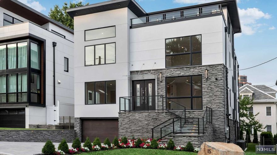 Welcome to this incredible 5 bedroom, 5 full and 1 half bath new construction home with spectacular New York City views. This approximate 6,000 sq. ft. custom home features high quality materials and state-of-the-art amenities throughout. Enter through the foyer to find the spacious open floor plan with formal living and dining rooms, home office, family room with fireplace and a modern Chef's eat-in kitchen with high-end appliances and oversized quartz center island. The second level features a master suite with 2 walk-in closets, luxurious master bathroom and a private terrace with stunning Hudson River views. Three additional bedrooms, 2 full bathrooms and laundry room complete the second level. The spacious rooftop level is perfect for entertaining with wet-bar, full bathroom and 2 separate outdoor spaces boasting New York and Hudson River Views. The ground level features a family room, game room, guest suite, full bathroom, covered patio and access to the 2-car garage.