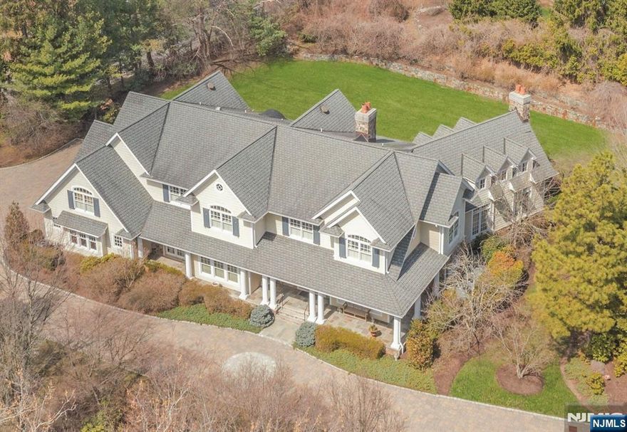 This 8200+ sf country farmhouse is situated on a picturesque acre. The design is unique and has great features throughout. 3 fireplaces, one in the large foyer entry, plus the den & great room. The expansive dining room is beautiful & the vaulted great room has 6 dormered windows, built-ins surrounding the stone fireplace and a wet bar opening to the den/fpl & built-ins. There is a bedroom/bath that also doubles as an office, and a custom country kitchen with large island & high-end appliances & breakfast area. A full bath and formal powder room & laundry complete the 1st floor. The 2nd floor primary suite offers a sitting room, a boutique closet & cedar closet, large bath with separate shower, jacuzzi & vanity area. Four bedrooms, 3 baths, 2nd laundry, and large media room. Semi-finished lower level with bath and utilities. 3 car garage, and patios. Private acre with great supporting value.