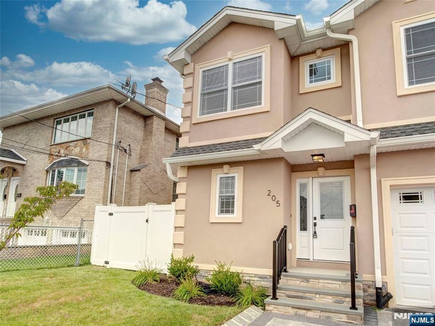 Introducing this stunning brand-new construction duplex for rent, offering 3 spacious bedrooms, 2.5 bathrooms, and upscale finishes throughout. The first floor features an inviting entry with a flex space ideal for an office or playroom, adjacent to a convenient half bath perfect for guests. The open-concept layout seamlessly connects the living room, dining area, and chef's kitchen, complete with a center island, quartz countertops, designer backsplash, and premium stainless steel appliances. Step outside to a private side yard, ideal for outdoor entertaining or relaxing. Upstairs, enjoy three well-sized bedrooms, including a luxurious primary suite with two walk-in closets and a modern en-suite bath featuring a double vanity and stand-up shower. A full hallway bathroom and laundry hookups, with two additional generously sized bedrooms flooded with natural light complete the second floor. Additional includes a fully finished basement for entertainment or flexible use, an above-ground garage, and one additional parking space. This completely private unit blends style, space, and comfort in an unbeatable location.