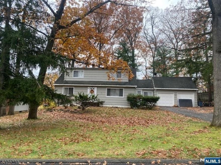 This spacious 5 bedroom, 2 bath custom Cape home is located on a quiet cul-de-sac in a desirable neighborhood. Featuring hardwood floors throughout, the home boasts a formal dining room, an eat-in kitchen with a newly installed wood-burning fireplace and a spacious living room and updated bathrooms. The property is situated on a nicely treed lot, providing both privacy and outdoor space for relaxation or entertaining. With updated electric, brand-new windows, air conditioning and a full basement offering endless possibilities. The attached 2-car garage adds convenience and extra storage space. Situated just minutes from great schools, shopping, dining, and commuter routes, this home offers both a peaceful retreat and easy access to everyday amenities. Don't miss the opportunity and schedule a showing today!