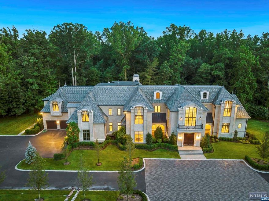 This 4yr old palatial, stone manor sits on 2 acres of a quiet, cul-de-sac street in one of the most sought after zip codes in the United States. Approximately 18,000 sq ft on all floors. First floor includes grand kitchen with breakfast room and butler's pantry, music room, dining room and great room with wine bar and guest suite. Library and 5 bedroom suites including Primary with his/her bathrooms and closet finish out the second floor. Lower level with theatre, spa with jacuzzi and fireplace, gym, massage room, billiard room with bar and guest suite. Garages can accommodate up to 12 cars. Elevator to all four floors. Security Cameras and media system throughout. Newly added full house generator. Large outdoor entertainment area in rear yard with fireplace, pool and spa. From the ultimate Primary Bedroom closet to relaxing in your very own 5 star spa, this home fits the wants of even the most discerning of buyers. Also available for a 12 month lease at $50,000 per month.