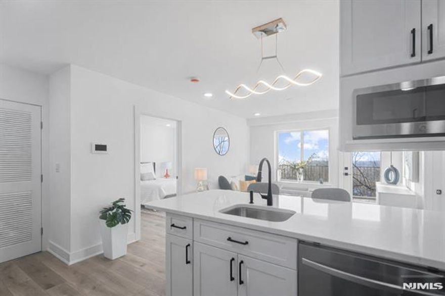 SELLER CONTRIBUTION TOWARD BUYERâ€™S CLOSING COSTS AVAILABLE ON THIS SPECIFIC UNIT. Meadowview Residences is a new construction 12-unit elevator building perched high with sweeping Meadowlands views and open exposures on all sides. This bright 2 bedroom, 2 full bath home features an open concept layout filled with natural light and a private terrace. Modern kitchen and in-unit laundry. Tucked away, yet just minutes to Manhattan via public transportation. Premium indoor garage parking with comfortable maneuverability available for purchase.