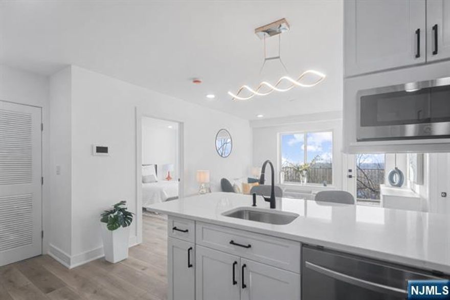 SELLER CONTRIBUTION TOWARD BUYERâ€™S CLOSING COSTS AVAILABLE ON THIS SPECIFIC UNIT. Meadowview Residences is a new construction 12-unit elevator building perched high with sweeping Meadowlands views and open exposures on all sides. This bright 2 bedroom, 2 full bath home features an open concept layout filled with natural light and a private terrace. Modern kitchen and in-unit laundry. Tucked away, yet just minutes to Manhattan via public transportation. Premium indoor garage parking with comfortable maneuverability available for purchase.