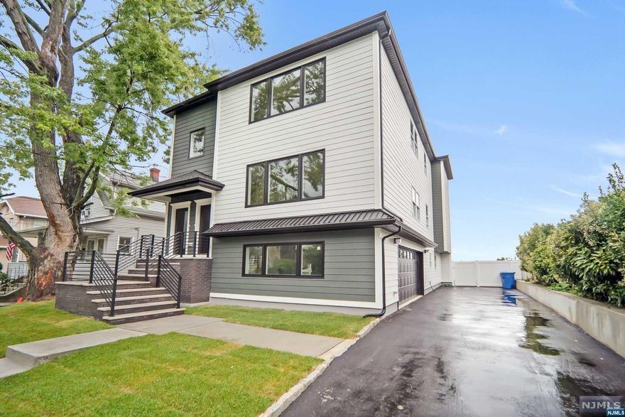 New construction, 2 family home w/2 car garage and driveway. Attention to detail in a very desirable section of Rutherford. Approx. 2 to 3 blocks to Train & NYC Bus. 3 Bedrooms per unit with 2 full bathrooms with a master suite! Kitchen with dishwasher, refrigerator, and stove in each unit. Hardwood floors throughout and tiled bathrooms. White kitchen cabinets, tiled backsplash with quartz countertop. Finished ground level with full bathroom and recreation room with sliders to backyard. Long driveway for approx 4 cars, private fenced-in yard. 2 Gas HVAC Heat & central air systems. NYC view from rear bedrooms! Estimated rental income 2nd unit $3,500 per month or $42,000 per year. Property tax based on conversations with Tax Assessor should be $27,000 to $28,000 per year.