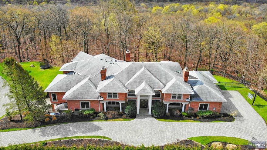 Unmatched in every aspect, 14 Shinnecock Trail, is a palatial all brick estate that accommodates the demands of our current day lifestyle & boasts luxurious living w/ the utmost privacy perfectly nestled on over 2.5 park-like acres in Highview Gate of Urban Farms. Hallmarked by meticulous craftsmanship & modern amenities, each of the sumptuous 17 rooms has its own special flavor. Among the long list of features are intricate millwork, dual-bridal staircase in the entry foyer with soaring ceilings, two-story great room w/ walls of windows & FP, brand-new gourmet kitchen with top of the line appliances & wood paneled home office! Two grand & light-filled MBR quarters are each comprised of his/her closets & unparalleled MBAs. The lower level brings outdoors in w/ a luxurious two-story climate controlled indoor pool, a state-of-the-art home theater, spa, home gym, and so much more. Outdoors one will find fully landscaped green acres, a carriage house, and a 3-par mini golf course!