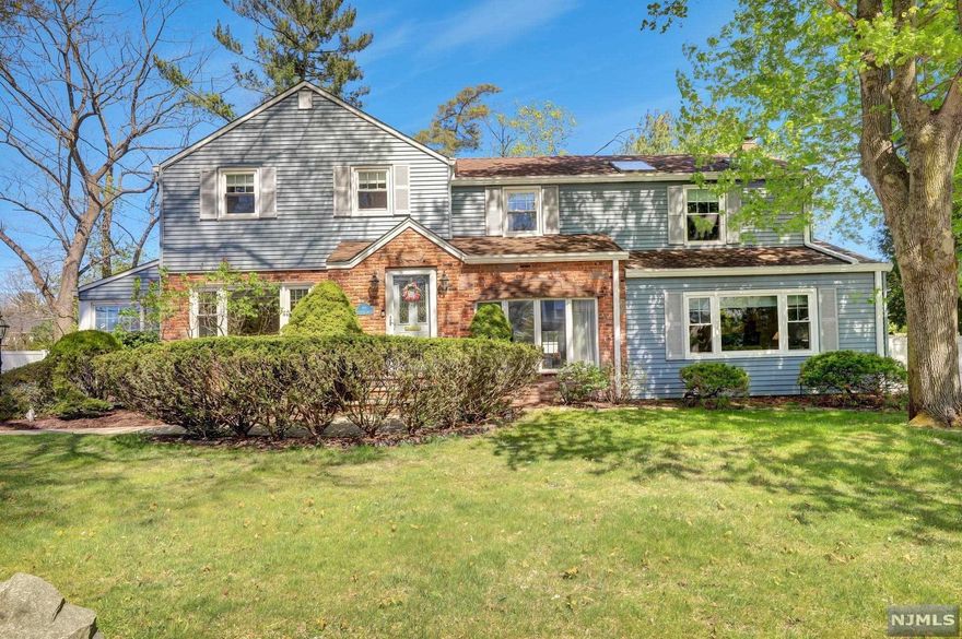 Welcome to this beautiful, expanded 4 Bedroom Colonial in the Northern Valley. The first floor features a very large dining room, living room, generous sized family room with a separate laundry room, powder room and eat in kitchen with a wonderful view of the beautiful fenced in yard. Off of the kitchen is a fabulous bonus room. The all glass, all seasons room with skylights is perfect for relaxing. The second floors offers a large primary suite with high ceilings and skylights as well as a walk in closet. Three more bedrooms and a bathroom complete the second floor. The basement is mostly finished and wonderful as a den, office or recreation room. What an incredible private backyard this home offers. Access to the yard is off of the all seasons room as well as the family room. An enormous two car garage and oversized driveway completes this beautiful home.