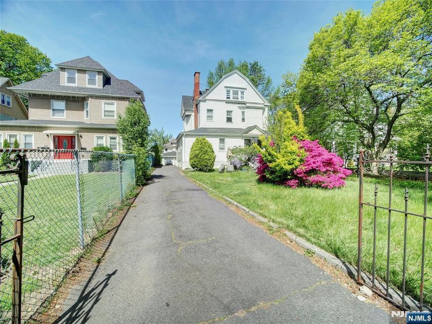 HUGE 60 x 200 lot size property. Welcome to 59 S Maple Ave, a beautifully renovated 2-family home offering both incredible investment potential and a versatile living space for future homeowners. This expansive property features 14 bedrooms and 6 bathrooms across four levels, providing ample room for comfortable living and additional income opportunities. The first-floor unit, featuring 3 bedrooms and 2 bathrooms, will be delivered vacant ideal for owners who want to occupy one unit while generating rental income from the others. It can be duplex with basement offering additional 4 bedrooms and 1 bathroom.The second-floor unit includes 4 bedrooms and 2 bathrooms, currently leased at $2,600 annually, and the bonus third-floor has 3 bedrooms and 1 bathroom with a private entrance, This home was gut renovated just four years ago, including modern upgrades such as quartz countertops, hardwood flooring in select units, and all new plumbing, electrical, and roof. A detached two-car garage and spacious driveway offer parking for 5"6+ vehicles, adding further value.Located in a rapidly growing East Orange neighborhood, this property offers a unique opportunity for both investors and homebuyers.Whether you're looking to occupy one unit and rent the others or expand your investment portfolio, this turnkey property has something to offer for everyone.