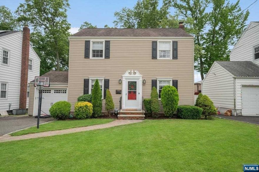 Situated in the desirable Oak View section of Bloomfield, this Center Hall colonial boasts 3 bedrooms, 1.5 baths and a large, deep property. Entering in, you'll find a large living room with custom shelving, a dining room that opens to a renovated kitchen and an updated half bath is just off the kitchen allowing for privacy. The 2nd floor boasts 3 bedrooms, all with ceiling fans and an updated full bath. The basement is partially finished, one side perfect for a rec room and the unfinished portion houses your utilities, washer & dryer and is great for storage. From the kitchen you'll access the rear yard, stepping out first to a covered patio with trex style maintenance free decking, an absolute ideal space to enjoy those warm summer evenings. From this covered deck you can step down to a lower patio for even more entertaining and seating. NYC transportation is just a few blocks away. Central AC, forced hot air & a one car att garage.