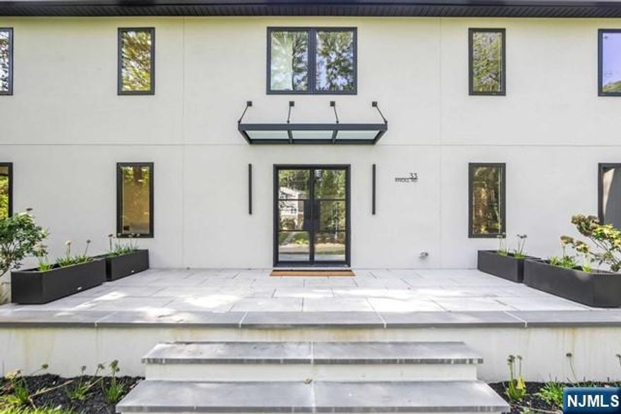 Presented by Bahr Rapaport-The Rapaport Group 9178481784.Situated on half an acre in the prestigious East Hill of Tenafly, this approximately 6200 sq. ft. residence offers luxurious living with 6 bedrooms and 5 full baths. The bright and open layout features a custom gourmet kitchen with Thermador appliances, a pantry and a wine bar. Enjoy a pre-wired movie theater and a dedicated gym room for entertainment and fitness. The first floor includes a versatile bedroom/cabana, ideal for guests or a private retreat.A seamless indoor-outdoor flow is elevated with a covered patio and a gunite heated pool. The home is generator-ready and energy-efficient, boasting dry cell foam insulation. Owner holds NJ real estate license.