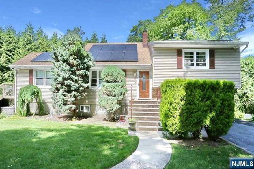 Why settle for an apartment when you can rent a house? This spacious home offers four levels of well-designed living, a private yard, and an excellent school district. Plus, included solar panels provide valuable energy savings -perfect for cutting electric bills and charging electric vehicles. Begin your tour in the sun-drenched first-floor living roomâ€”the first of twoâ€”in this thoughtfully designed home. Just beyond, the beautifully updated kitchen features stainless steel appliances (including a smart refrigerator), granite countertops, and a center island with seating. The kitchen opens into a luminous dining area with a skylight and sliding doors to the deck. From there, the space flows naturally around the corner into the family room, which also features a skylight. Upstairs, youâ€™ll find three comfortable bedrooms and a full bath. The ground-level suite, with its own private entrance, offers a fourth bedroom, a second living room, and another full bath - ideal for guests, extended family, or a home office. Additional highlights include an attached garage and a generously sized yard, perfect for relaxing or entertaining. This isnâ€™t just a rentalâ€”itâ€™s a place to call home. Tenant responsible for utilities, lawn care, snow removal, the first $150 of any repair, and full cost of repairs due to tenant negligence.