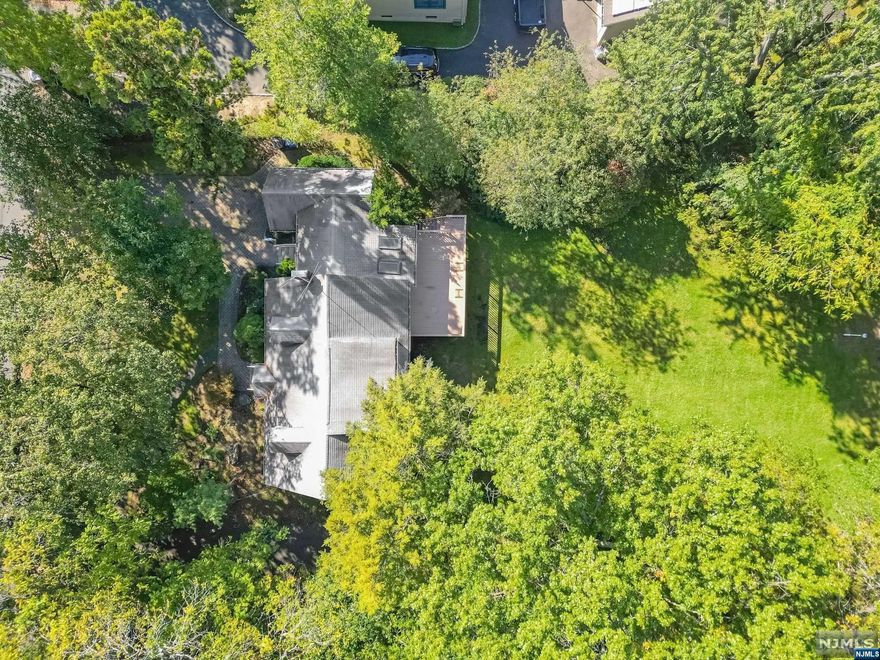 HUGE half acre property, in a prime location, with LOW TAXES! Solid brick cape with a true extended family set up. This unique home offers two bedrooms and a bathroom on the main floor, plus an updated one bedroom apartment on the 2nd floor. There's a one car garage and two separate driveways for ample parking. The basement has a separate ground level entrance, high ceilings, and plumbing for a full bathroom. Quality steel beam construction with great bones. A fantastic opportunity to transform this house & property into the home of your dreams. Near NYC Bus, Houses of Worship, Schools, and Parks. This is an Estate Sale being sold in strictly as-is condition. Buyer responsible to obtain any certificates that may be required for closing. Listed by Romy Ouziel (917-922-9348) and Eric Wein (201-410-1556).