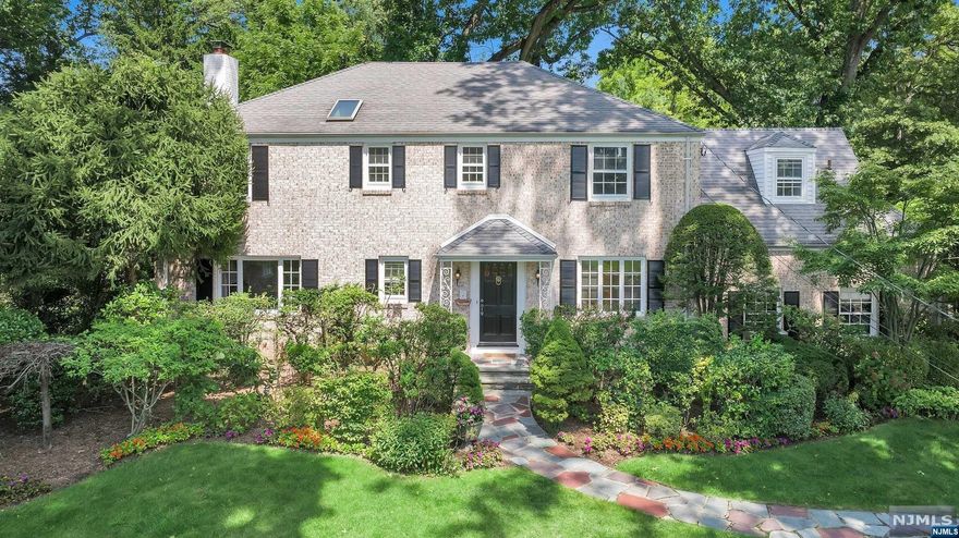 Incredible opportunity to own this magnificent home on Fairmount Rd in Ridgewood's esteemed Willard school district. As you step inside, you'll be greeted by a beautifully crafted curved staircase in the entry hall, setting the tone throughout. The front to back living rm features a fireplace, while the adjacent family rm provides a comfortable space just off the eat-in kitchen w/ convenient mudrm. Entertain in style in the formal dining rm, complete w/ a charming bay window & builtins, then step into the office w/ sliding doors that open to the patio & lush gardens. Recently refinished hardwood floors grace both the 1st & 2nd levels, creating a seamless flow throughout. The 2nd story boasts 5 bedrooms & 3 full baths, including a luxurious primary BR suite w/ a sitting rm, Juliet balconies, fireplace, dressing area & an ensuite BA. The LL is finished w/ tile flooring, laundry rm, a half bathroom & a recreation rm. Don't miss the opportunity to call this majestic home your own!