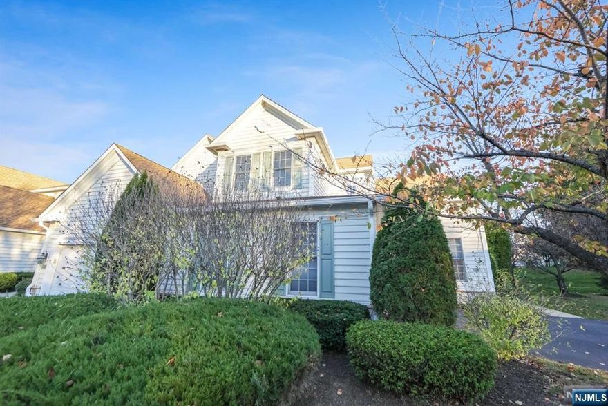 Discover pristine elegance in this Deerfield model ,nestled in the Brettonwoods At Paramus. This home boasts a beautifully landscaped private yard with a deck, offering scenic views. Inside, the first-floor owner's suite exudes luxury, featuring a tray ceiling, an expansive walk-in closet, and thoughtful design elements throughout. Step into luxury with a masterfully designed master bath, complete with custom moldings, and a linen closet. The modern eat-in kitchen opens to a welcoming family room, where a gas fireplace sets the scene for entertaining. Additional highlights include a formal living room, dining rm, PR, and a large laundry room for ultimate convenience. The second floor boasts two generously sized bedrooms connected by a stylish Jack-n-Jill bathroom. A versatile loft area provides the perfect space for a home office! Finished basement has an extra bedroom w/full bath. NYC bus stop around the corner! Effortless access to all highways.