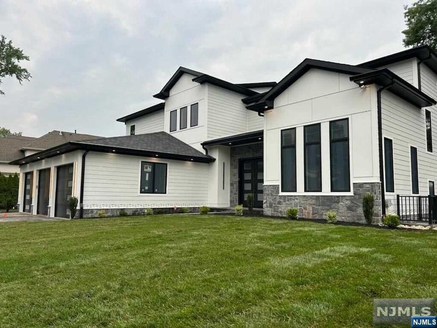 Bahr Rapaport 917.848.1784 and premier builder Lumaj Properties brings you private resort style living! Approximately 6,000 sqft of livable space, on 0.4 acre property in prime location. First floor features a spacious open floor plan with formal living room and fireplace, chef's eat-in kitchen, family room, library / office, direct access to the heated garage, mud room, powder room. Stunning large format doors overlooking the luxurious backyard, with an in-ground pool/outdoor kitchen/outdoor full bath/covered deck. Second floor features , a luxurious primary suite, three additional bedrooms each with en-suite bathrooms, and a laundry room. The fun continues in the basement with a large recreational room, wet bar, Theater room, gym, bedroom, full bath and direct access to the outside. No detail spared: 6 bath radiant heat, underground electrical, central vacuum, 3 zone ac/heat, sprinkler system, backup generator, audio/security system, LED recessed lighting, 10 year warranty