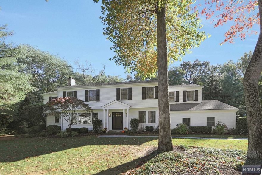 Beautiful Center Hall Colonial located in one of the most desirable sections of Demarest. Over 1/2 acre of resort like property backs up to the 55 acre Demarest Nature Center. Spacious home features 6 BRs, 3 Full and 1 Half BA with newly updated hw flooring on 2nd floor, refinished kitchen cabinetry, and custom paint throughout. Gourmet chef's kitchen, large formal dining room, and 2 story great room with palladium window overlooking the rear of the property make this home ideal for entertaining. Large bluestone patio and mature landscaping creates a beautiful and serene outdoor entertaining space. Plenty of flex spaces for recreation, gym, office, and storage throughout. Located in a Blue Ribbon school district and close to parks, shopping and transportation. Owner holds NJ RE license and will offer a 1 year Home Warranty to buyer.