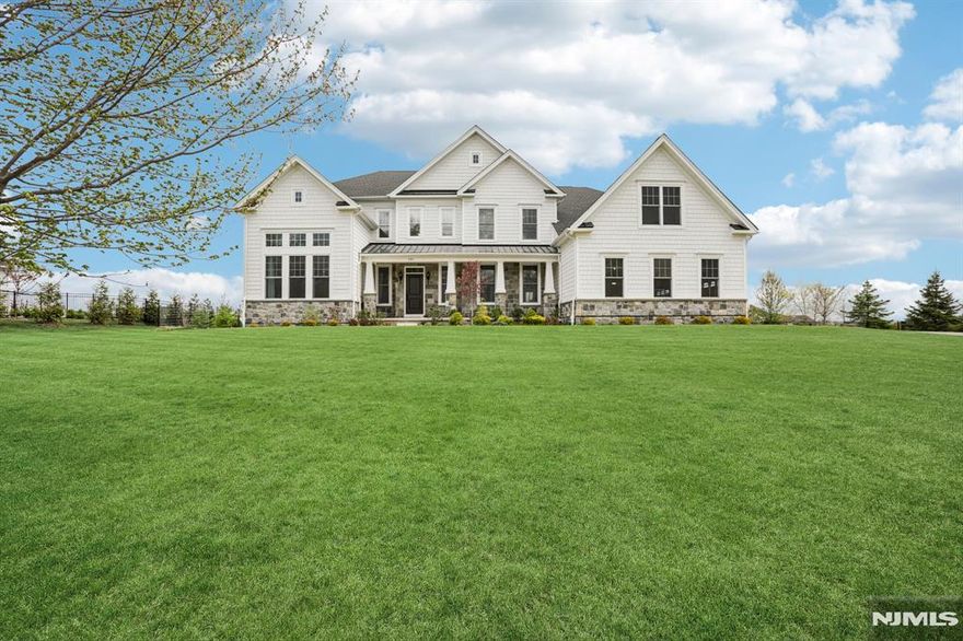 Welcome to this stunning 2023 new construction in desirable Mahwah, built by renowned Toll Brothers. This exceptional 5-bedroom, 5.5-bathroom residence offers refined elegance, modern comfort, and exquisite craftsmanship throughout. A grand two-story entry foyer with a dramatic double staircase creates an unforgettable first impression. The main level features a formal living room and a grand family room with a fireplace, perfect for both everyday living and entertaining. A private den/office adds flexible space. The chefâ€™s kitchen is the heart of the home, showcasing an oversized center island and seamless flow into the spacious dining area, ideal for gatherings. A first-floor bedroom with a full bath provides excellent guest or extended living accommodations. Upstairs, the spectacular primary suite offers a luxurious retreat with a generous walk-in closet and a spa-inspired bath complete with a soaking tub. Three additional bedrooms are beautifully appointed junior suites, and a large second-floor family room provides versatile additional living space. The fully finished walk-out basement is designed for entertaining, featuring a bar area, a full bath, and direct access to the backyard patio. Additional highlights include extensive custom moldings throughout, solar panels for energy efficiency, electric vehicle charging capability, and a three-car garage. A great opportunity to own a nearly new luxury home in one of Bergen Countyâ€™s most sought-after communities.