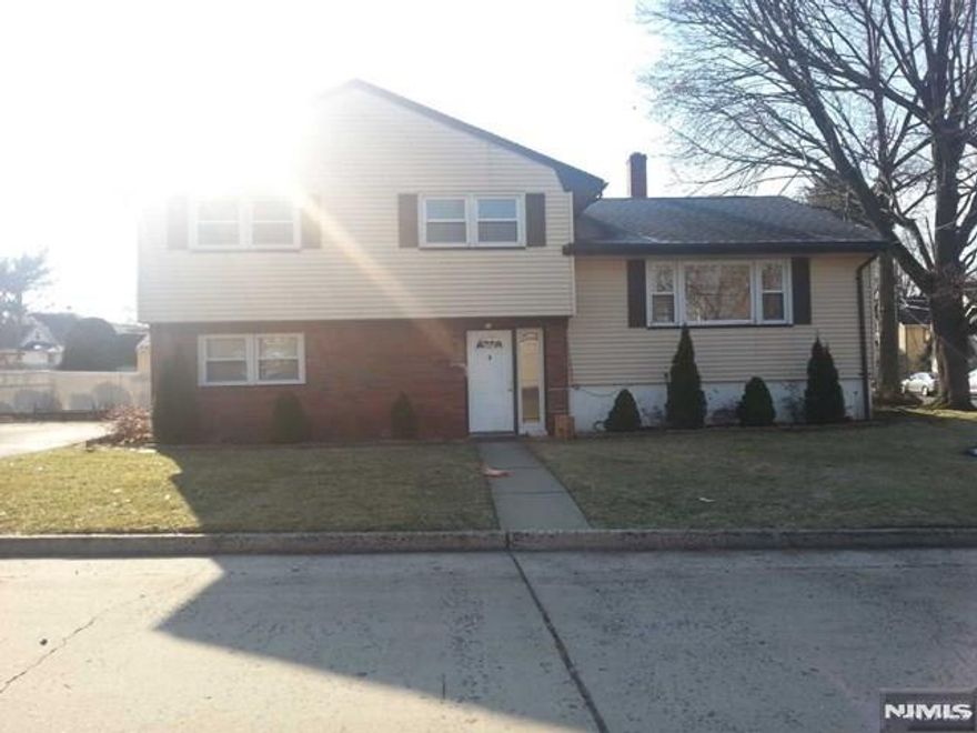 Welcome to this lovely 3 bedroom, 2 bath home situated on a large corner lot in quiet, charming neighborhood. Enter into a large foyer with spacious family room and renovated full bath. The first floor features a bright living room, with an open dining area, and a large newly renovated kitchen with stainless steel appliances and recessed lights. The 2nd floor consists of primary bedroom with 2 large closets and 2 additional bedrooms, new renovated full bath. All bedrooms have hardwood floors and ceiling fans. The full basement offers laundry and additional space to be finished to suit your needs. Attached 1 car garage with additional parking for 3 spaces. All appliances and light fixtures stay. Property is being sold as is. Must See won't last.