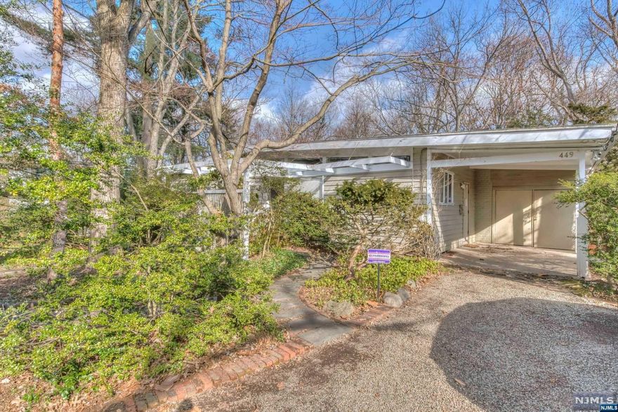 This charming ranch-style home in Englewood, NJ offers a tranquil retreat in a park-like setting. With 3 bedrooms and 3 bathrooms, it provides ample space for families or those who enjoy entertaining. This home boasts stunning views and a peaceful atmosphere. The spacious living room features large windows that allow natural light to flood in, creating a bright and inviting atmosphere. The open-concept kitchen and dining area provide the perfect space for hosting guests, with plenty of room to gather around the table or relax by the cozy fire. the bedrooms are all generously sized and offer plenty of closet space. The primary bedroom features an en-suite bathroom. Outside, the property offers a beautiful outdoor space perfect for relaxing or hosting events. The creek behind the property adds to the peaceful ambiance and provides a unique touch of nature. The property is a true oasis in the heart of Englewood, providing a rare combination of city convenience and natural beauty