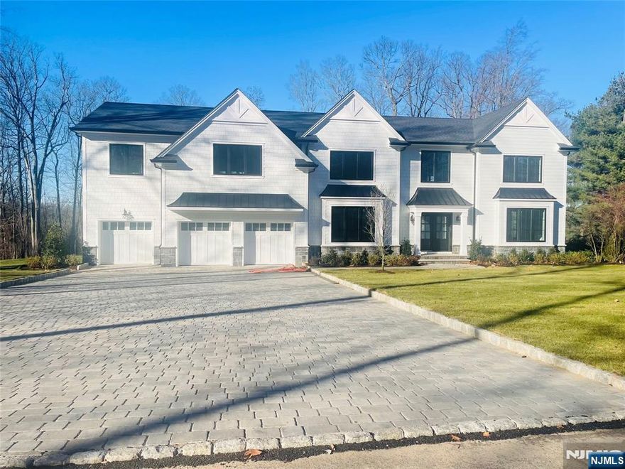 Welcome to this new construction luxury residence offering an unparalleled blend of modern design and thoughtful functionality. With approx 7,100 SF of elegant living space, this expansive 6-bedroom, 5.5-bathroom home is situated on a generous 200 x 253 private lot. Youâ€™re greeted by a paver driveway and walkway that lead to a stately entrance. Inside, discover hardwood floors throughout, soaring ceilings, and a sophisticated open-concept layout designed for both comfort and entertaining. The heart of the home is a modern kitchen, featuring Sub-Zero and Wolf premium appliances, sleek cabinetry, and an oversized center island with quartz countertops. All six bedrooms are generously sized, each offering ample closet space. The luxurious primary suite includes a designer bath, 2 custom walk-in closets (1 which you could live in), and peaceful backyard views. The home also includes a full finished basement, ideal for a media room, gym, playroom, guest quarters, offering exceptional flexibility and additional living space.Enjoy year-round comfort with four-zone heating and air conditioning, ensuring energy efficiency and personalized climate control.Step outside to your private backyard oasis featuring a bluestone patio and beautiful landscaping for added privacy. Great schools, scenic parks, and convenient access to NYC, this exceptional property presents a rare opportunity to own brand-new construction in an established, sought-after community.