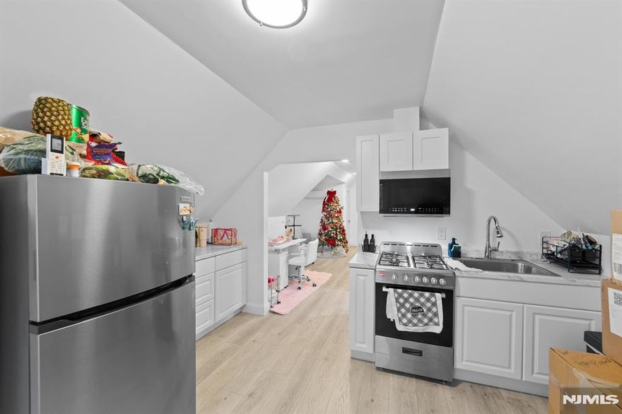 Renovated in 2024, this two bedroom, one bathroom apartment features an eat-in kitchen equipped with stainless steel gas appliances, a cozy living room, and convenient off-street parking. Enjoy year-round comfort with four ductless heating and air-conditioning units, including individual units in each bedroom for customized climate control. The private entrance is located at the rear of the property, offering added privacy. Water, snow removal, and landscaping are included in the rent. No pets and no smoking. Owner holds a real estate license.