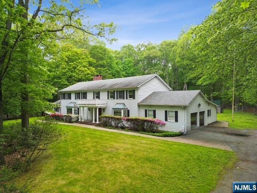 Nestled on a conveniently located, flat Saddle River lot approximately 3 acres in size, 75 Woodcliff Lake Road is a grand center hall colonial built in 1967 presenting a rare and exciting opportunity. Boasting substantial square footage and classic architectural details, this residence awaits a thoughtful renovation to realize its inherent potential. Just imagine crafting a magnificent private estate with an expansive and exclusive backyard oasis limited only by your vision and creativity. 75 Woodcliff Lake Rd is a fabulous template ready to be transformed into the home of your dreams, including the possibility for generational living. With a nearly Olympic sized swimming pool and tennis/basketball cout, don't miss this chance to create something truly special to enjoy and create magnificent memories with your loved ones! PLEASE NOTE: The tax records and survey differ regarding lot size: municipal records indicate 3.21 acres versus the survey, which notes a 2.83 acre lot. This is an estate and is being sold strictly AS IS.