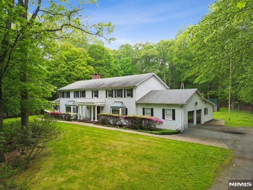 Nestled on a conveniently located, flat Saddle River lot approximately 3 acres in size, 75 Woodcliff Lake Road is a grand center hall colonial built in 1967 presenting a rare and exciting opportunity. Boasting substantial square footage and classic architectural details, this residence awaits a thoughtful renovation to realize its inherent potential. Just imagine crafting a magnificent private estate with an expansive and exclusive backyard oasis limited only by your vision and creativity. 75 Woodcliff Lake Rd is a fabulous template ready to be transformed into the home of your dreams, including the possibility for generational living. With a nearly Olympic sized swimming pool and tennis/basketball cout, don't miss this chance to create something truly special to enjoy and create magnificent memories with your loved ones! PLEASE NOTE: The tax records and survey differ regarding lot size: municipal records indicate 3.21 acres versus the survey, which notes a 2.83 acre lot. This is an estate and is being sold strictly AS IS.