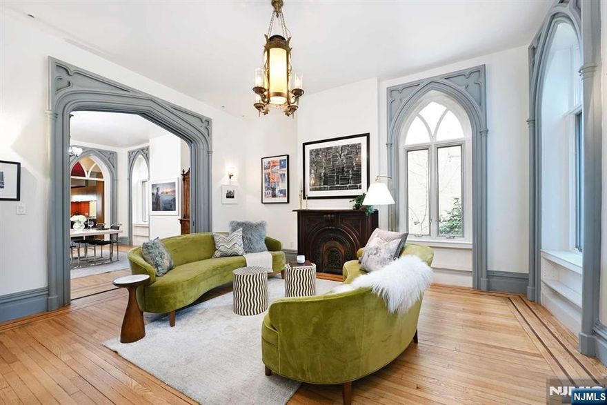 Welcome to this unique freestanding single-family home featuring expansive NYC views on a 50x150 lot. This 4800 sq ft 5 bedroom, 3 bath home includes a home office and a one-bedroom guest house with a private entrance and full bath. The impressive size and high-end features has sun-filled interior delivers a 'wow' factor with 11-foot ceilings, archways, moldings, inlaid floors, and tall windows. Initially built in 1860, the mansion was fully renovated and expanded in 2008. The first floor includes a gym, flex space/home office, guest/nanny room, and laundry. The parlor level showcases craftsmanship with separate formal living, dining area, family room, and a HenryBuilt kitchen. The top floor features a primary suite with a designer bathroom, sauna, terrace, and two additional bedrooms. The large yard offers space for entertaining.