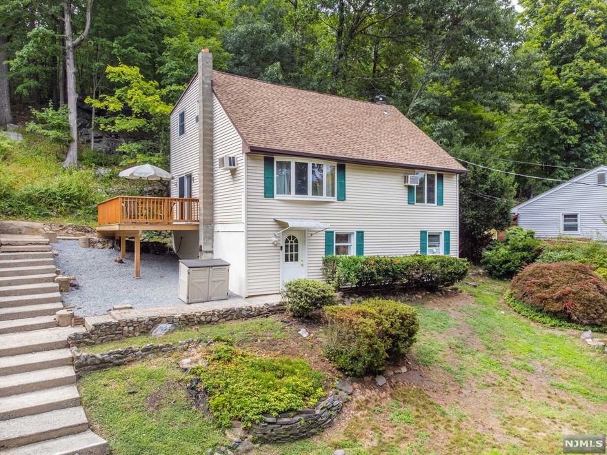 One of a kind custom raised cape cod in desirable Lake Telemark! Ground floor entrance features foyer area, laundry room, utilities & tons of storage! 1st FL feat. spacious living room w/bay window, EIK w/freshly painted cabinets & portable pantry, bedroom, office/playroom & FB w/ tub/shower combo. 2nd FL incl. master bedroom w/ his & her WIC, 2 additional guest rooms & FB w/stall shower. Other feat. include brand new deck, ceiling fens, 6 year old septic system, new HWH, newly paved driveway & new railing. Blinds, window treatments, window & wall AC units, W/D & appliances included! Lake Telemark offers lake access, playground & clubhouse. Discounted annual rate available. Lake dues not mandatory!