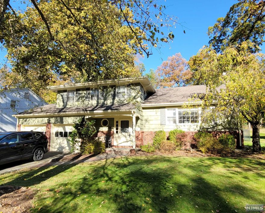 Welcome Home! Spacious Split Level w/ 2 Car Garage on one of the most desirable streets in town! Awesome Location on Double Cul-de-sac. Formal living room overlooks the sunken formal dining room. Spacious eat-in-kitchen with breakfast bar opens to the Family Room, perfect for hosting and entertaining! Bonus Room addition off the rear of the home can be another hangout space, playroom or office! Upstairs are 4 spacious bedrooms with beautiful hardwood floors and ample closet space and updated bathrooms. Master suite features double closet plus a full bathroom! Expansive & private back yard with large patio. Close to Bloomfield Ave & Downtown Caldwell (Shops, Restaurants, NYC Bus). This home has plenty of space & privacy... it is sure to please!