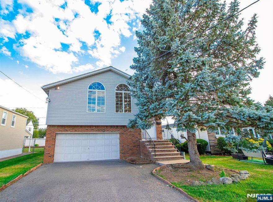 Welcome to this beautifully updated bilevel single-family home featuring 3 bedrooms and 3 full bathrooms, perfectly blending modern style with everyday comfort in the heart of Elmwood Park. Step into a bright, airy living room that flows seamlessly into the dining room and on to the kitchen, creating an easy, partially open layout for entertaining or family gatherings. All three bedrooms are conveniently located on the same floor, including two full baths for added convenience. The ground level offers a very spacious family room, an additional full bath, and a dedicated laundry area, providing extra living space for movie nights or entertain. Outside, enjoy a private driveway with parking for multiple vehicles. Ideally located close to schools, shopping, dining, parks, and major highways, this move-in-ready home delivers suburban comfort with excellent commuter access to New York City. No pets allowed. Donâ€™t miss this Elmwood Park gem â€” schedule your private showing today!