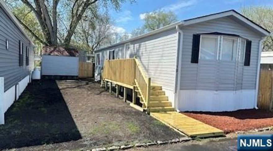 Amazing opportunity to own a home in Wayne, NJ! Presenting this beautifully renovated 2 bedroom, 1 bath home in Finns Mobile Home Park! Enjoy high ceilings, good size bedrooms with ample closets, open living room/dining/kitchen area and new luxury vinyl flooring throughout! Laundry area equipped with hook-ups, as well as cabinets overhead. Central air and heat via ductless mini-split units. New roof, siding and deck outside, as well as grass seed spread for a beautiful new lawn. There is also an outdoor shed included giving you great storage space. On-site Clubhouse and fenced-in playground. Great option if you're looking to own vs rent, first time home buyer, downsizing, 1 floor living or just love the area! Cash preferred. If mortgaging, at least $20k deposit required. Interested buyers must fill out community application and be cleared before an offer will formally be accepted. Monthly fee includes lease of land, water, garbage, septic, plowing, maintenance of common areas. Lawn is homeowner's responsibility.