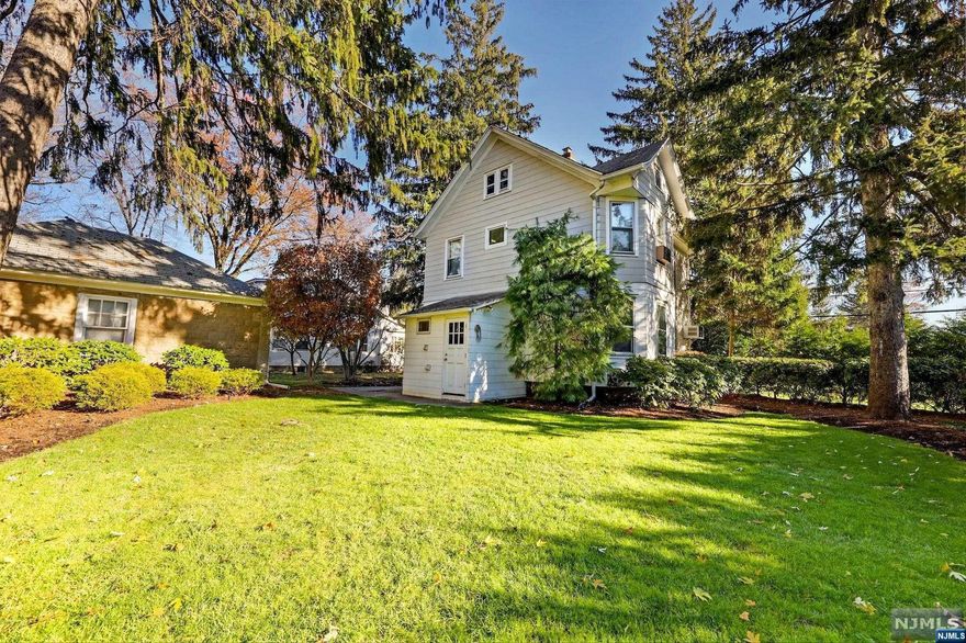 Great Location! Desirable town with highly rated schools. This Delightful historic well maintained colonial sets on quiet street, walkable to downtown Hillsdale and the train! This home has been well maintained and is deceiving from the front. Large Living and Dining Rm (converted currently to a Den) plus an eat-in Kitchen with built-in table. First floor Laundry too! Upstairs are FOUR bedrooms plus a walk-up attic for possible office space or playroom. Newer carpet throughout but original wood floors under carpet. Basement is accessed from backyard and has a photography darkroom with sink. One car detached garage is spacious and dry. Private Large backyard surrounded by privacy bushes ideal for outdoor entertaining. Minutes from downtown Hillsdale and easy access to GSP. Excellent starter home or investment property! This one won't last!