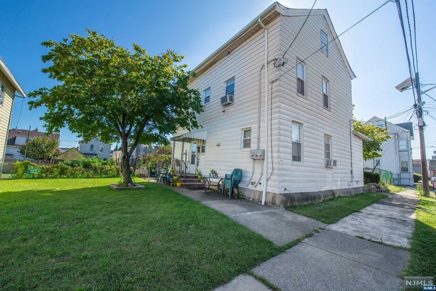 This spacious 2-family home presents an extraordinary opportunity as it sits on an oversized 75 x 100 lot. The property features an unfinished walk-up attic and basement, offering ample potential for additional living spaces or storage solutions. The second-floor apartment has been freshly painted and features a cozy living room, eat-in kitchen, one bedroom, and a full bathroom. The generous 1st-floor unit boasts a spacious living room, an inviting eat-in kitchen, three bedrooms, a family room, and a full bath, providing comfort and space. This home is being sold 'as is,' offering you a canvas to bring your renovation ideas to life. Adding to the appeal of this residence is its proximity to essential amenities and services. Commuting is a breeze with easy access to NYC transportation options, major highways, and shopping nearby.