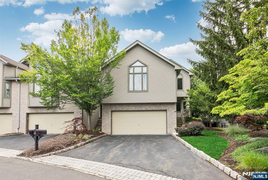 Desirable End Unit, Corner Cascade Model townhouse w/ 3000+ sq ft of living space, in the exclusive, full amenity Northwoods Complex, is one of only a few units w/ its own private drive leading to the attached 2 car garage. Move right in to this spotless end unit w/ 4 bedrooms and 3 full and 1 half bath. Spend time w/ your loved ones in the spacious MEIK w/ granite counters that leads to the family room with sliders to the deck overlooking a large grassy back yard. Enjoy the dual sided fireplace while entertaining in the dining room or relaxing in the living room with soaring ceilings. Privacy awaits you in the Primary suite with private, primary full bath while your other guests or family members can relax in the 3 additional bedrooms, 2 full and 1 half additional baths. Many updates include white, Quartz Counters in all 3 full baths, new refrigerator, washer and dryer, microwave, 3 sinks and a renovated lower level with full sized windows providing natural light! Enjoy the tennis court, pool, gym, play ground, renovated clubhouse or the picturesque natural setting in the Northwoods Complex including a gorgeous pedestrian walking path. Hardwood floors, freshly painted, desirable floor plan and plenty of natural light enhance the appeal of this spacious townhome. Top rated schools and close to public transportation, Whole Foods, parks, restaurants & shopping! Rental application link will be provided upon request.