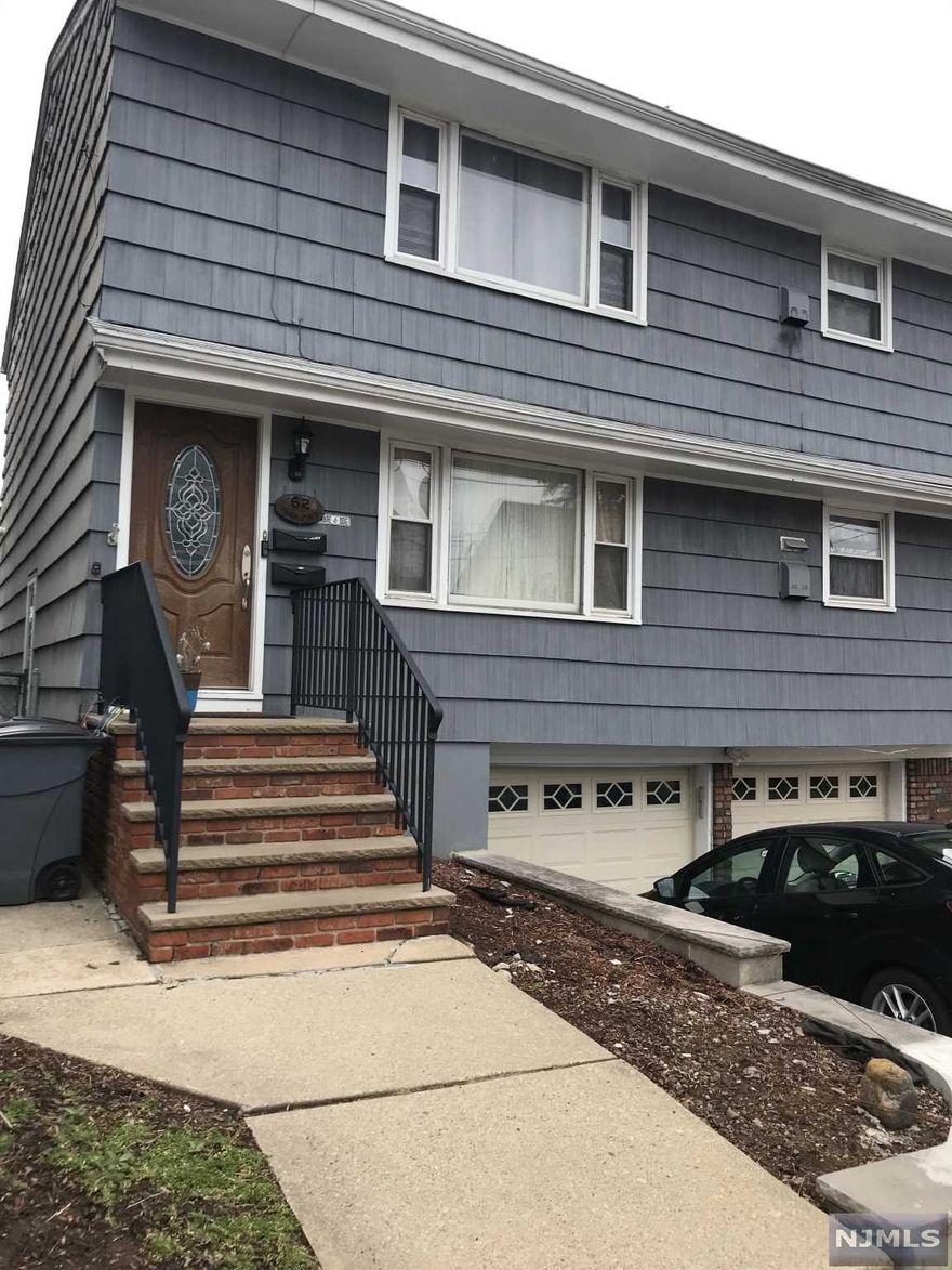 Wonderful opportunity!! Great location on a cul de sac with walking distance to shops, schools, parks etc. Large top/bottom 2 family home with 2 bedrooms, full bath, and eat in kitchen in each unit. Hardwood floors, all separate utilities, 2 garage, and plenty of storage. Must see!!