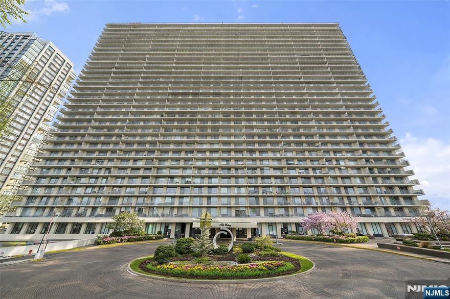 Welcome to this stunning high-floor residence at The Colony, one of Fort Leeâ€™s most prestigious full-service buildings. Located on the 23rd floor, this spacious 1-bedroom, 1.5-bath unit features a large private terrace offering breathtaking sunset and mountain views. The home has been tastefully updated, with a modern kitchen featuring quartz countertops, tiled backsplash, white cabinets, stainless steel appliances, a breakfast counter, and recessed lighting. The original dining room has been thoughtfully converted into either a second bedroom, den, or home office, offering flexible living options. Crown moldings throughout, wood floors run throughout, and the primary suite includes two walk-in closets, a third closet, access to a terrace, an updated, fully tiled en-suite bathroom, and an updated powder room. The Colony offers full-service amenities and an exceptional lifestyle in one of Fort Leeâ€™s most desirable locations. Conveniently located near Hudson Lights for shopping, dining, and entertainment, and just minutes from the GW Bridge and all major highways.