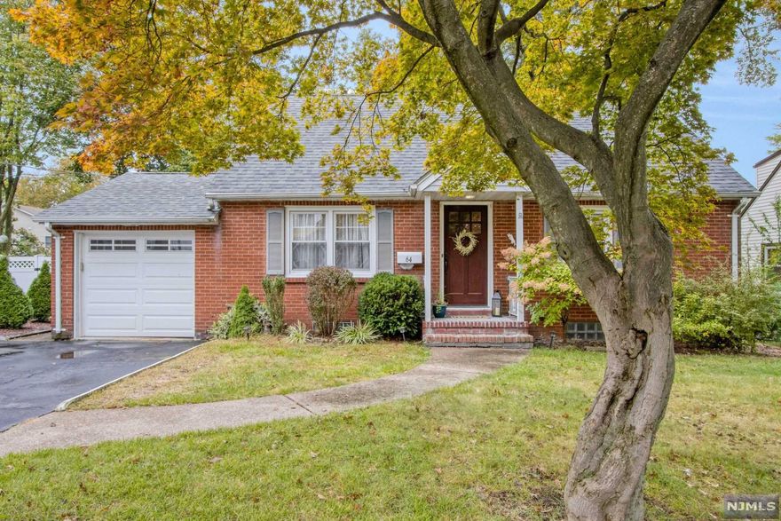 Beautifully expanded home with so much welcoming curb appeal, located right in the Heart of Emerson. Enter into this expanded home with a bright and spacious formal living room. Large family room, open to an immaculate eat-in kitchen featuring custom white cabinets, granite countertops, center island, stainless steel appliances and vaulted ceiling with skylight. First level bedroom and updated full bath completes the first level. Second level offers two large bedrooms, an updated full bath and sitting area. Finished lower level including recreation room, laundry and storage. Large backyard featuring spacious deck and paver patio. Great for family gatherings and entertaining. Located close to town, shopping, schools, Manhattan and NJ transportation.