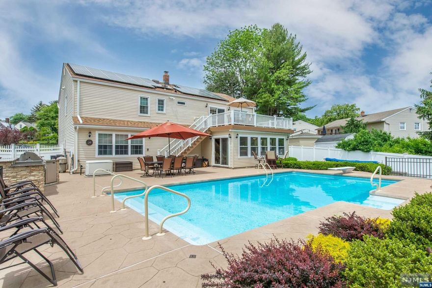 Look no further! Your own private oasis spectacularly located on a cul de sac surrounded by new construction!Renovated in 2016 with salt water in ground pool added & fully equipped outdoor kitchen! Perfect multigenerational living opportunity with nothing spared in upgrades-hardwood floors,custom tile, crown molding & more!State of the art kitchens with Viking, Miele, & GE Profile stainless steel appliances, granite & custom tile backsplashes! Remote office spaces both levels!Radiant heat lower level in bathroom & four season room.State of the art helmut gutters.Owned solar panels provide fabulous energy discounts.Whole house built in generator too!Recent improvements include new hot water heater,kit cabinets,& butcher block cabinets.Absolutely nothing to do-turn key-just unpack,move in, & enjoy year round indoor & outdoor entertainment & relaxation areas!Close to schools,shops,rest,trans!