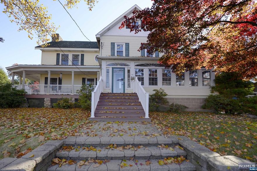 You're in love with the warmth, charm and architectural detail you find in older houses - and you also want an open floor plan, modern amenities and a like-new feel. Can you really have both? Well come see this big, beautiful colonial and see for yourself. Love to entertain? Guests can cluster in the kitchen around the big center island or spill into the adjacent family room and cozy up by the gas-ignition fireplace. Summertime parties? The french doors let you float right on out to the wrap-around porch. First floor master bedroom? Check. Newer baths? Check. Plenty of room for all with a four bedrooms and a laundry room upstairs - and a finished basement below. 5 zone heat...2 zone central air...large yard...super-convenient commute to Manhattan, schools, parks, shopping, and houses of worship.