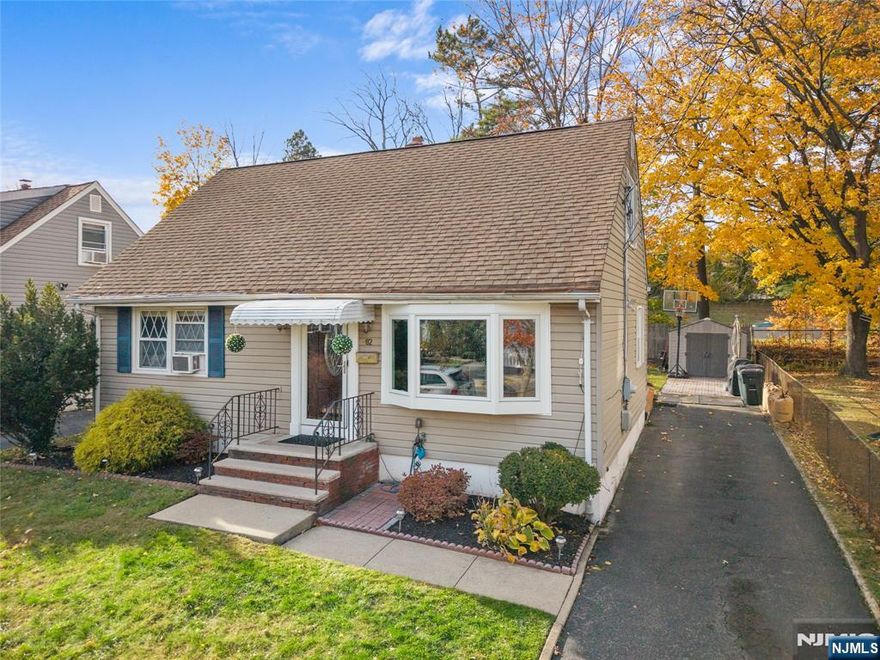 Welcome to this beautifully updated 3-bedroom Cape Cod nestled on a quiet, tree-lined street in one of Clifton's most sought-after areas. From the moment you arrive, you'll fall in love with its inviting curb appeal and warm, welcoming feel.Step inside to discover a bright and airy living room that flows seamlessly into a formal dining room perfect for gatherings and special occasions. The renovated kitchen features sleek countertops, modern cabinetry, and stainless-steel appliances, making it a chef's delight.The first floor offers easy living with a full bath, a comfortable bedroom, and a versatile home office or guest room. Upstairs, you'll find two spacious bedrooms with cozy nooks and ample closet space.The finished basement expands your living area with a recreation room, laundry zone, and plenty of storage. Step through the dining room to a covered back porch that overlooks a spacious backyard perfect for barbecues, relaxation, and outdoor fun.Enjoy the comfort of central air conditioning, updated finishes throughout, and a location that can't be beat close to NYC bus lines, excellent schools, parks, and shopping.