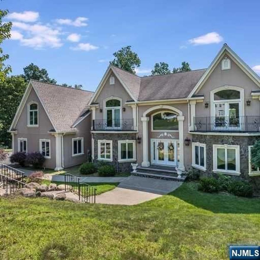 Nestled in the prestigious community of Franklin Lakes, this exquisite custom-built colonial home presents itself as a timeless masterpiece, gracing the landscape with its undeniable charm & elegance. A true embodiment of luxury living, this residence, standing proudly for 20 years, encompasses over 4,700 sq. ft. of sheer opulence. Stepping through its grand 2-story foyer, adorned w/ intricate details, a bridal staircase serves as a striking centerpiece, setting the tone for the architectural brilliance that unfolds within. The open floor plan seamlessly connects the various living spaces, creating a harmonious flow that is both inviting & captivating. The heart of the home is found in the 2-story family room, illuminated by natural light. The FPL stands as a focal point, radiating warmth throughout this welcoming space. Through the FRM's entryway lies a deck that beckons you to step out & indulge in the serenity of the 1.85-acre lot.