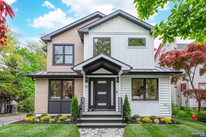 Be the FIRST to live in Millburn's newest built modern luxury estate! You are first greeted by herringbone hardwood floors & two-story foyer that leads you towards the heart of the home. A masterpiece chef's kitchen awaits featuring soft-close modern cabinets, top-of-the-line appliances & a 14ft center island w breakfast bar. Luxury is woven into every detail from the exquisite chandeliers & finishes to the designer wallpaper. Rounded arches grace the interiors & the open-flow layout & warmth of the living room fireplace invites comfort. A large deck off the family room is perfect for indoor/outdoor living overlooking your .23 acre oversized lot with huge backyard. The master suite is a sanctuary w vaulted ceilings, private balcony & ensuite spa bath w wetroom. Spacious guest bedrooms provide comfort w 2 ensuite bedrooms for added privacy. The walkout basement features a private ensuite, living area & 2 car garage w mudroom. This is more than a house; it's a masterpiece of living!