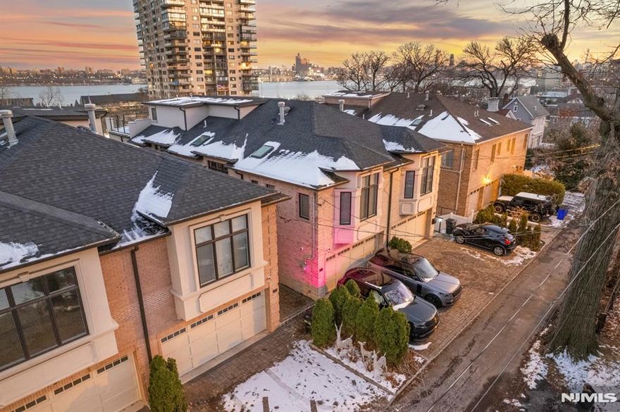 This oversized duplex is located in the sought after 'Glen Road' row of Duplexes. Many upgrades abound both inside & outside of this beauty. Starting with a private gate (w/keypad), for entry onto River Rd., located right at the bus stop. Inside walk onto the warm radiant heated HW floors adorned with elaborate molding. Full home automation from "Savant" home systems for lights, heat, doorbell, security cameras (both interior & exterior) all from your phone. Enjoy a luxuriously large kitchen accompanied by a welcoming den w/fireplace and large east facing windows. All 4 bedrooms are en-suites; two with jacuzzi tubs, one has 10"ft ceilings. The master bedroom is like a 5 star hotel room. Its enormous with the (bumped out) large windows with views, the centered fireplace, huge walk in closet, & spa-like bathroom. Great for entertaining from lower level w/bar and wine room to roof top fl sky lounge & sun deck w/view from GW bridge to Mid Town. Very convenient location.