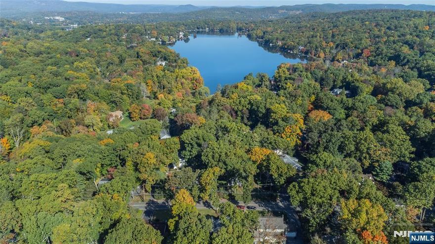 Looking for privacy & a peaceful environment.Look no further!This expanded ranch style home is exactly what you are looking for in desirable Pines Lake!A beautiful front porch, tiled entrance foyer leads to a nicely sized LR offering a welcoming space.The kitchen features a breakfast bar, granite counters, premium tile backsplash, custom cherry wood cabinetry & ss appliances, making it stylish as it is functional with plenty of room for cooking & entertaining.The kitchen opens to an adjacent dining area.Large family rm has abundant natural light from large windows, creating a bright & comfortable atmosphere that frames wonderful backyd views & 2 sets of sliding glass drs lead to an expansive rear cedar deck perfect for outdoor entertaining,al fresco dining &taking in stunning sunset views.Convenient laundry rm w/oversized tile stall shower, ample cabinetry. Hrdwd flrs on main level. A few steps from the main living area is the primary bedrm w/private full bath + 2 add'tl bdrms &3rd full bath.The home is nestled on a private .344 acres with an expansive fenced yd that provides endless opportunities for outdoor activities. 2 car garage, flat driveway, ample parking & a location close to NYC transit, shopping & dining.This home offers the perfect blend of modern comfort & relaxed living.Pines Lake is a members only lake community 24 miles from NYC that offers boating,fishing,swimming,tennis,PB,basketball,a children's summer program, various clubs & community events.