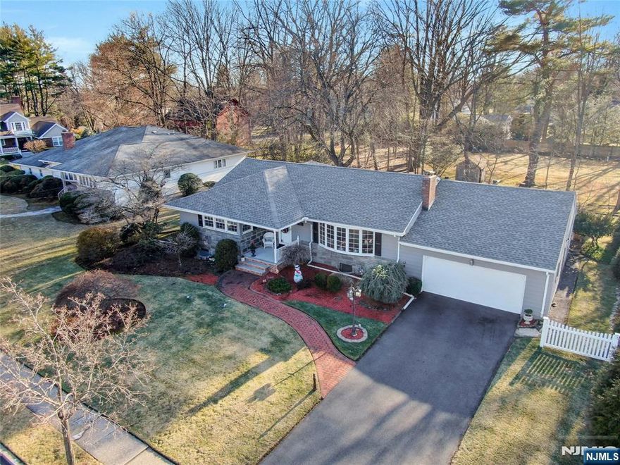 Nestled on a quiet cul-de-sac in the highly sought-after Blauvelt section of Oradell, this beautifully maintained ranch offers an exceptional blend of comfort, space, and future potential. The main level features three bedrooms and two full bathrooms, including a primary en-suite, all conveniently located on one floor. The sun-filled living areas include a spacious living room with feature fireplace, a formal dining room, and an eat-in kitchen with granite countertops. A standout family room showcases an accent window and sliding doors leading to a generous deck, creating seamless indoor-outdoor living. A three-season porch, also opening to the deck and private backyard, provides the perfect space for relaxing or entertaining. The fully finished lower level expands the living space dramatically, offering a huge recreation room with shuffleboard floor, TV lounge, wet bar, powder room, oversized walk-in closet, full second kitchen, laundry area, abundant storage, and interior access to the garage. Ideal for entertaining, extended living, or work-from-home flexibility. Set on a level, private lot with mature landscaping, the outdoor space offers both privacy and tranquility. Notable updates include a new roof, new bathroom, new driveway, and updated electrical panel. Enjoy this home as-is or take advantage of the rare opportunity to expand upward and create a stunning colonial-style residence in one of Oradellâ€™s most desirable neighborhoods. Is this the one for you? Come see!