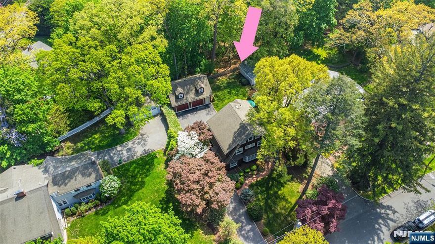 There's just something Magical & Enchanting about The Cedars and this house is no exception! Soak in the charm in every corner of this delightful Dutch Colonial.This 4/5 bedroom home boasts spacious room sizes, high ceilings and exquisite woodwork & molding throughout. Living room w/ stately wood burning fireplace includes 2 Cinderalla Benches original (1904) to the house, large dining room w/ French doors leading to a bonus room (would make a perfect den, office or playroom!), kitchen w/ charming breakfast nook & adorable built-in benches, powder room & convenient 1st fl laundry room. On the 2nd floor you will find 3 large bedrooms including the primary suite w/ walk-in closet & full bath. The 3rd floor has 2 more rooms which could be additional bedrooms (one has a closet), guest room, office or play room. Full clean unfinished basement with high ceilings, just waiting for your finishing touches! Detached oversized 2 car garage including a staircase to awesome loft space an incredible storage opportunity or perhaps a future finished guest space! Meticulously landscaped yard with large patio. This home sits proudly on a unique lot, offering uncommon privacy adjacent to a 2.5-acre glen which is a "Green Acres" passive park. Located just outside of Downtown Caldwell shops, restaurants, schools, Grover Cleveland Park & NYC transportation! Just one visit to this home and you will understand why the location is so special!