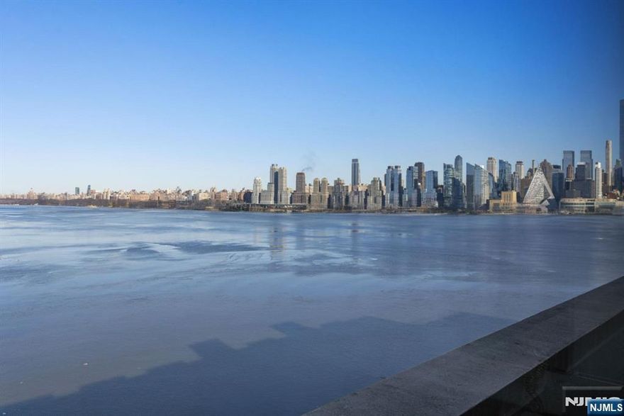 Welcome to Port Imperial! Perched on the Hudson River, this exquisite Corner Penthouse at the Avenue Collection offers an unparalleled lifestyle with breathtaking, unobstructed views of the iconic Manhattan skyline and the George Washington Bridge. Walls of glass flood the expansive, open-concept interior with natural light, complementing the soaring lofty 12-foot loft ceilings. Meticulously crafted exquisite finishes with a thoughtfully designed layout. A corner unit, with desirable NE & W exposure, provides a constant connection to the city that never sleeps, offering a fingertip-touch view of the famous New York skyline and the Hudson River right from your living space and your private wraparound balcony. This 911 sq ft, one-bedroom, one-full-bath penthouse provides a sanctuary of peace and elegance. Includes a 24-hour concierge, two hotel guest suites for visitors, an event room, a stunning rooftop plaza with panoramic NYC views, a business center, and a state-of-the-art fitness center with a sauna. Garage parking is available in the building, and a shared outdoor pool option is accessible at 1200 Ave at Port Imperial. The unbeatable location makes commuting a breeze. Just steps away from the NY Waterway Port Imperial Weehawken pier, where you can get to NYC in minutes. Experience the best of both worldsâ€”the tranquility of a riverside retreat and the vibrant energy of Manhattanâ€”at this most desirable address. Don't miss this opportunity to own at Avenue Collection!